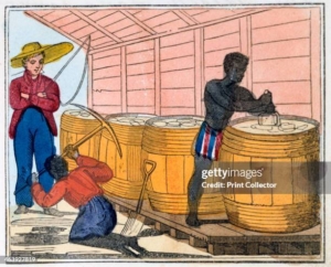 Historical scene of a 19th-century sugar mill: a Black worker stands at large wooden vats while two white overseers observe nearby; another worker kneels with a tool beside the vat and a shovel lies on the ground.
