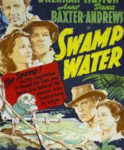 Vintage movie poster for Swamp Water with actors wearing hats, bold yellow title, and a swampy scene in the background.