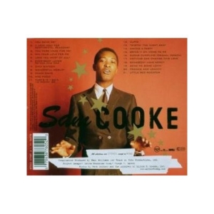 Music album cover: a man in a dark suit on an orange background with green stars and bold title text across the front.
