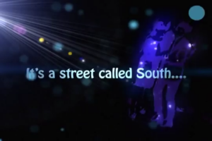 Dark urban scene with neon light beams and silhouetted figures; text overlay reads 'It's a street called South...'