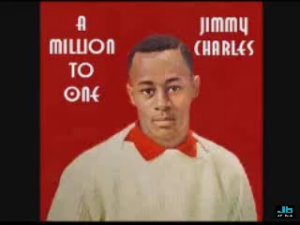 Album cover with Jimmy Charles, a man in a cream sweater and red bow tie, against a red background, showing the title 'A Million to One'.