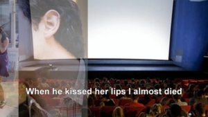 Cinema auditorium filled with people facing a large screen; caption reads, 'When he kissed her lips I almost died'.